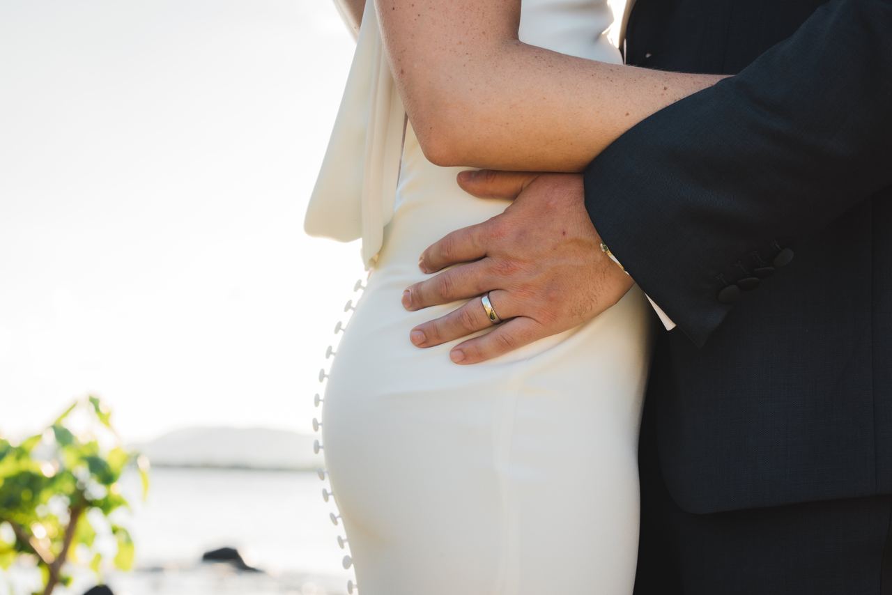 Wedding embrace by the water